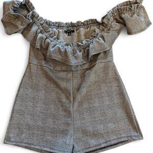 Black & white square pattern romper with ruffle neck and sleeves.